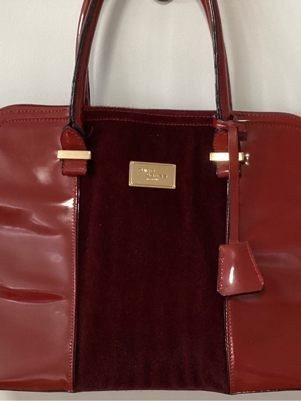 Womenโs Red Patent & Suede Shoulder Bag with Gold Plaque